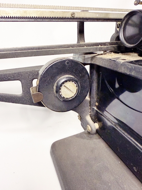 Remington "50" from the back, detail of the oversized mainspring needed to return the 26" carriage...