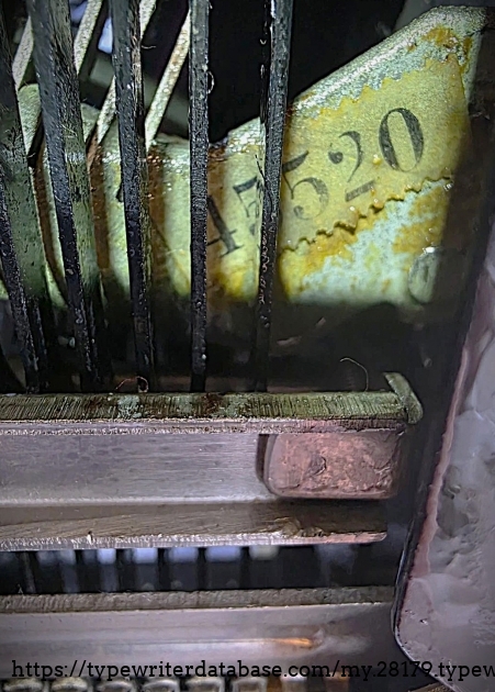 Underside close-up, showing serial number sticker.