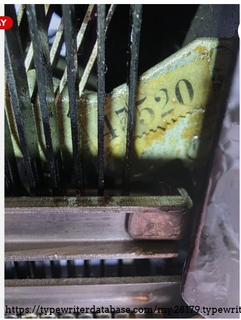 Underside close-up, showing serial number sticker.