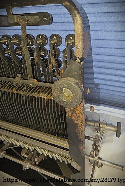 Underside view, showing some of the rust on the machine.