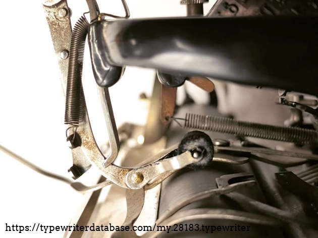 The typewheel and the ink roller are in their home position.