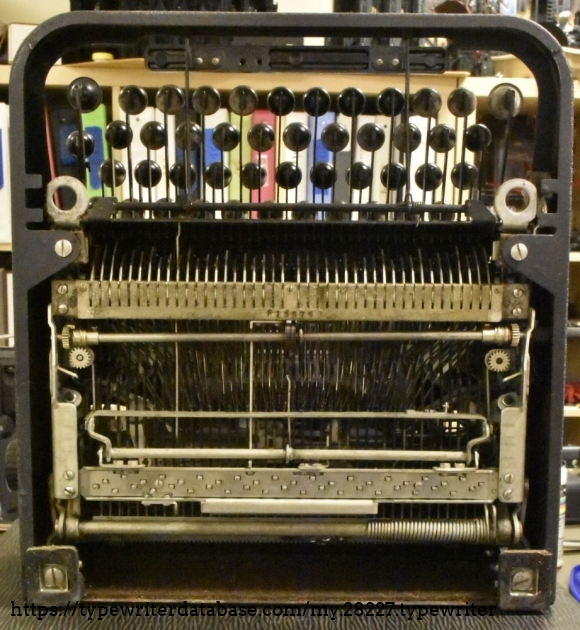 Front feet missing in this picture - as the part that goes into the holes is broken off like it is in many of these Underwood portables.