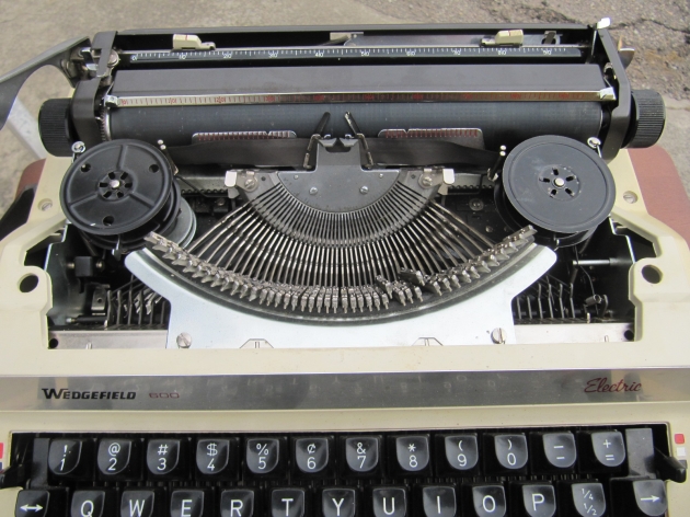 The left spool came with the typewriter. The right was a plastic universal spool, so I replaced it with an extra spool from an Underwood Four-Bank portable.