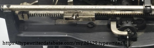 Crop of image with top plate serial number just visible.