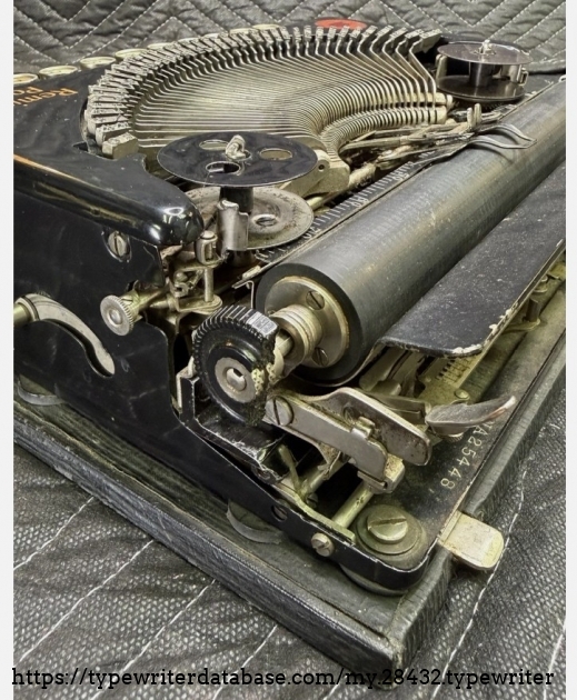 Right carriage end, showing broken platen knob.