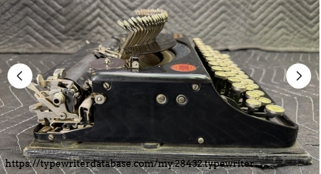 Left broadside, typebars extended.