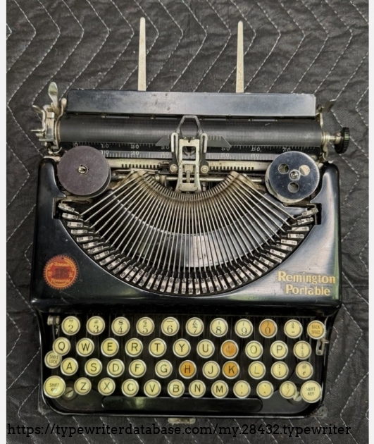 Front top-down, paper rests extended.
