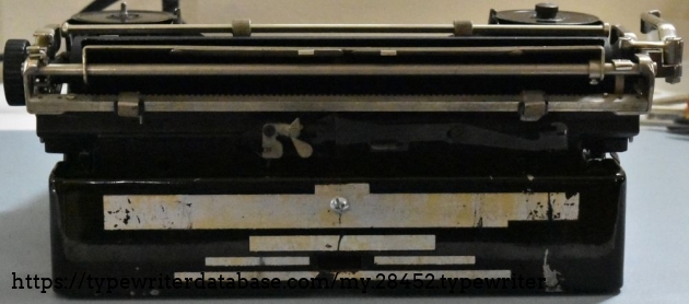 Sadly, all the markings on the back have been rubbed off.   Note the modern replacement screw in the middle.