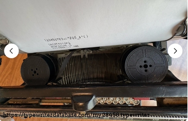 Top-down view of ribbon spools and carriage.