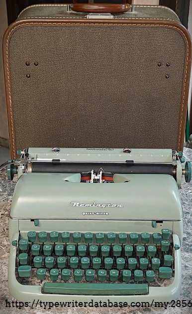 Front view with case behind the machine.