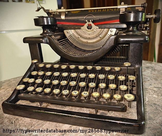 Front, slight-right.  Note the absence of a ribbon color selector in front.