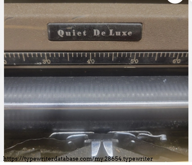 Paper table closeup, showing Quiet De Luxe badging.