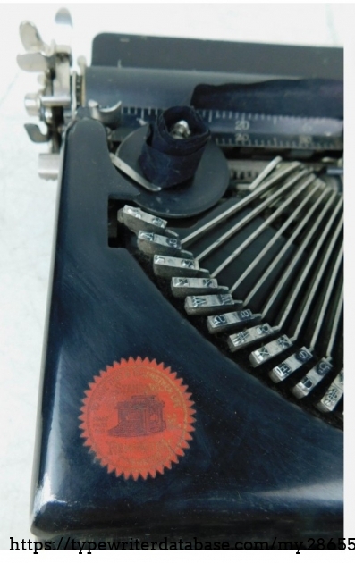 Detail of Rem typewriter decal and left end of type basket.
