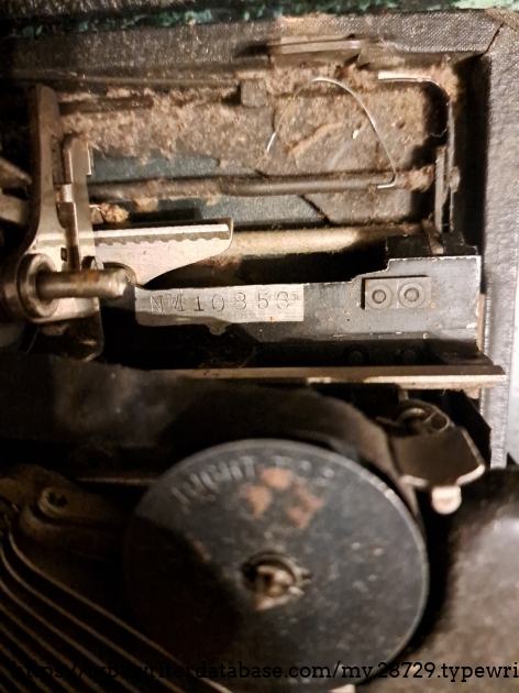Serial number.  I messaged the seller to get this image, and they provided it in the reply; but so far, they have not added it to the eBay listing gallery.