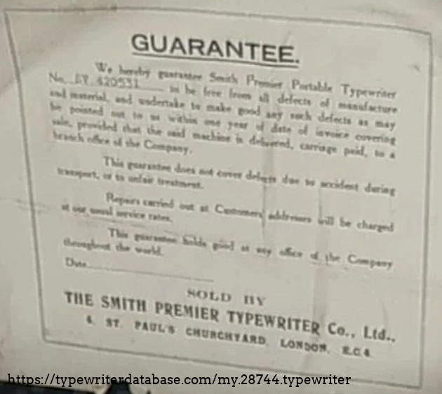 Guarantee label with just-legible serial number.