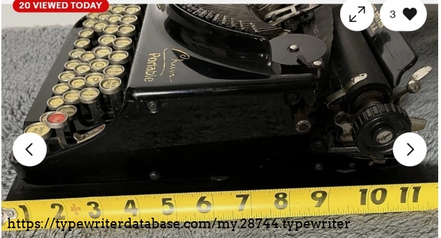 Right broadside with tape measure.