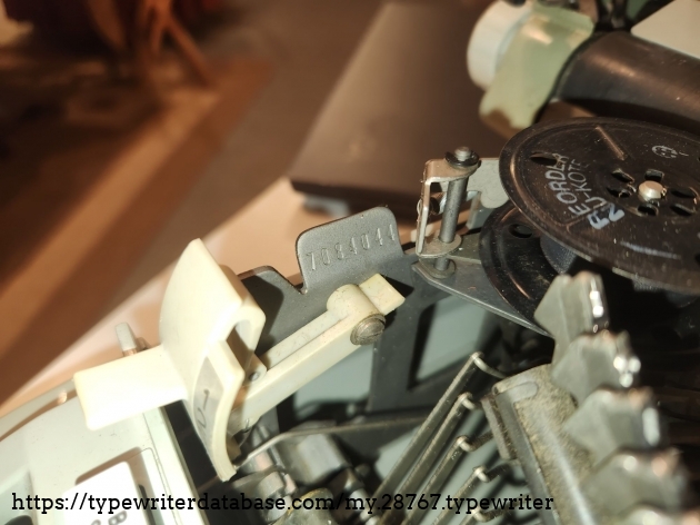 The serial number appears on the left side of the frame right next to the left ribbon cup.