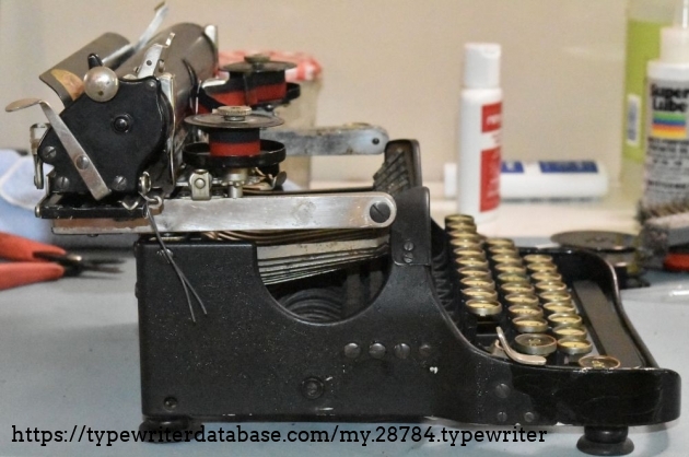 Ignore the wire, it is there to stop the carriage from going all the way to the left, as the escapement is broken.