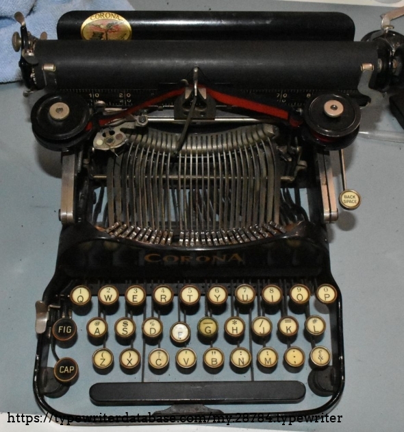 Having the typebar up engages the rigid dog, so that the carriage stays put.  The loose dog is broken.