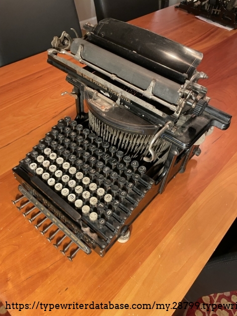 When I first saw this typewriter, I assumed there had been two missing keys which were replaced with black L keys, but those are actually bracket symbols with corresponding type slugs. See upper left and lower right keyboard corners.