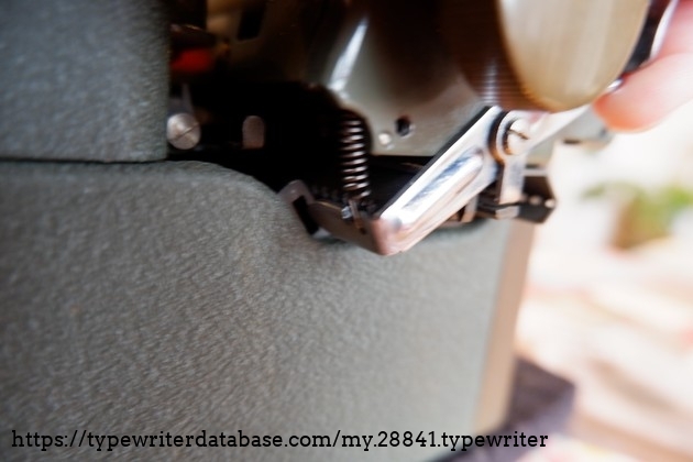 Carriage lock pawl and slot
