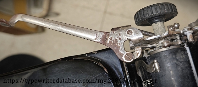 Carriage return lever, showing an indication of some of the corrosion on the machine.