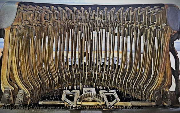 Typebars viewed from behind the machine.