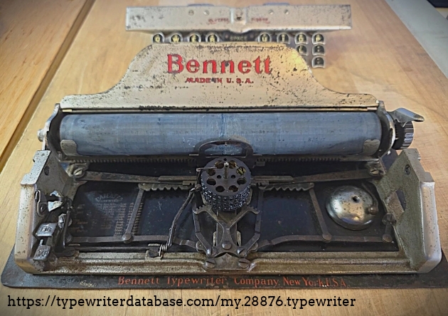 Front view with keyboard behind the machine.