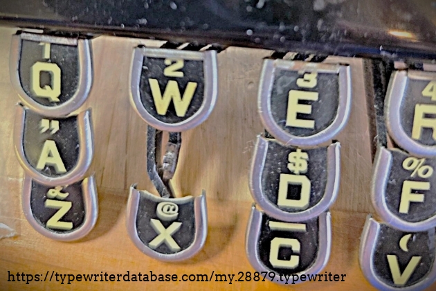 Keyboard closeup showing missing "S" key.