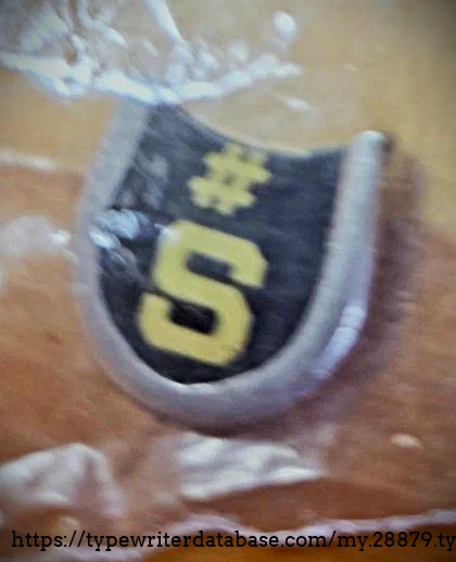 Missing "S" key in a plastic baggie.