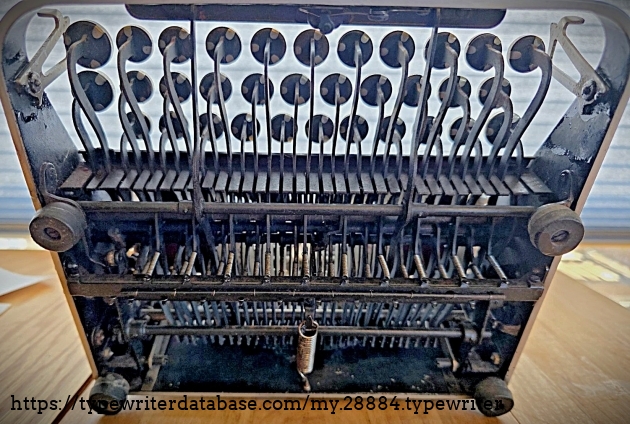 Underside, machine lifted to oblique angle.
