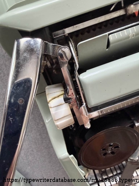 The cost of fixing the carriage return and making the machine usable was a broken left platen knob. As the right (and more important knob) works perfectly, this was an acceptable casualty to me!