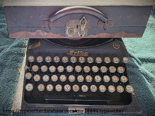 Case on top of typewriter.