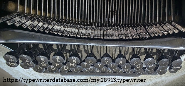 Keyboard and type basket, oblique top-down view.