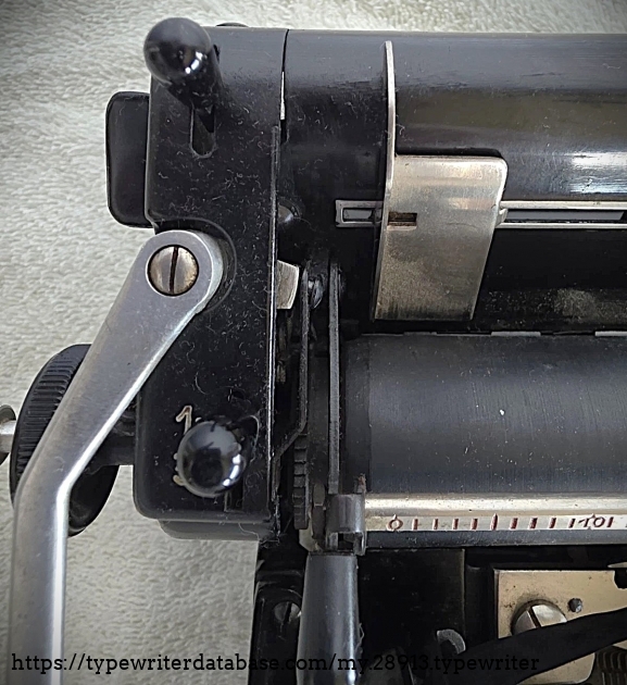 Left carriage end, carriage return lever, top-down.