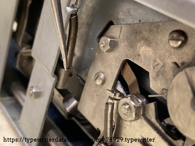 The screw and nut adjusts the trip.