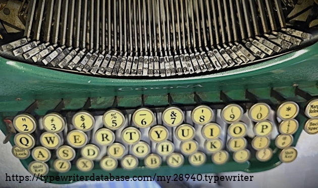Keyboard and type basket, top-down view.