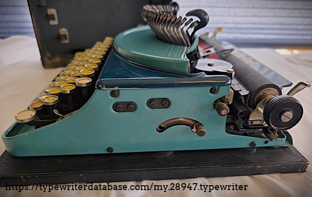 Right broadside, typebars extended.