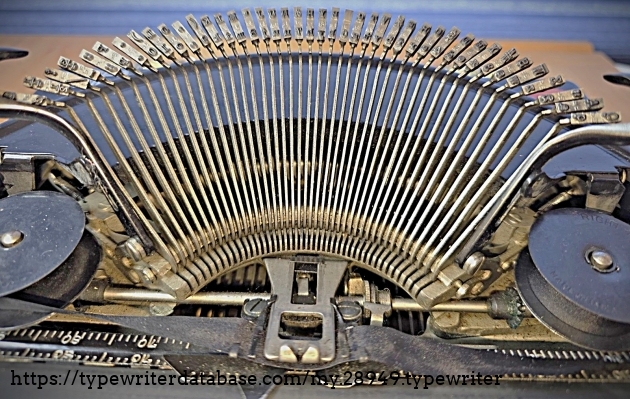 Type basket, with typebars indicating Elite typeface.