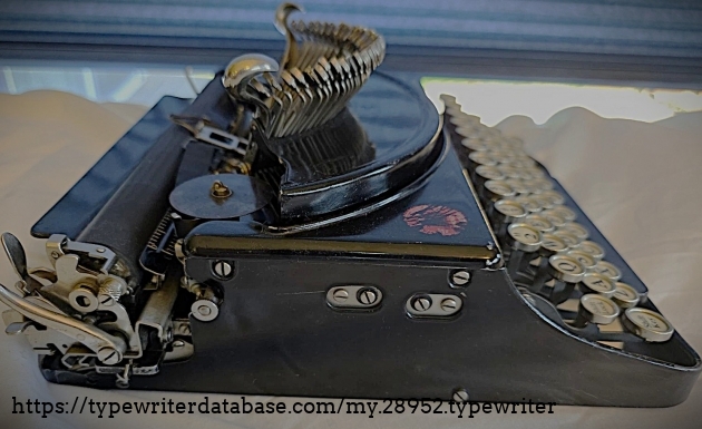 Left broadside, typebars extended.