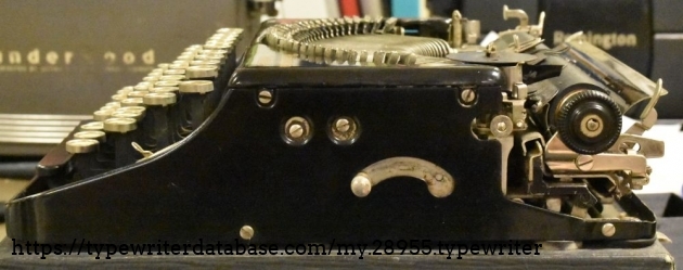 You pull the knob and move the lever to the back to raise the typebars to the ready position.l