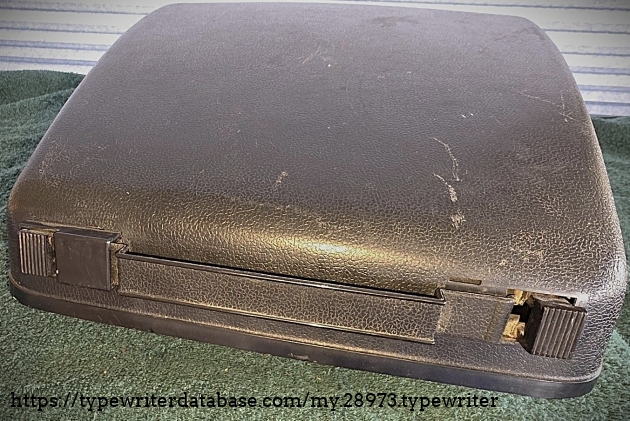 Case front.  Blow-molded plastic, which to my mind places it in the 1970s.