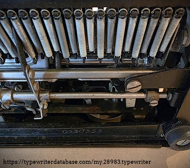 Underside view showing location of serial number at back of machine.
