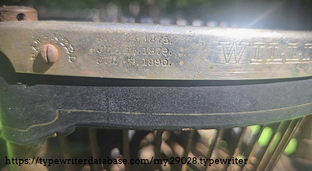 Front nickeled rim, patent dates, left.