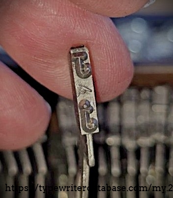 Detail of "J" type slug, showing pica foundry markings.