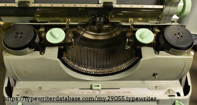 The dials are for the card holder.  I guess when you needed to use carbon copy paper, that ability to adjust these was important.