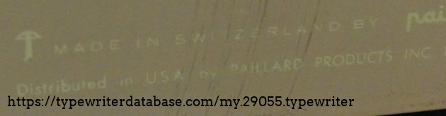 The logo on the back.  The thing that initiallly looked like a mushroom is a crossbow - which makes sense with the William Tell legend and Switzerland.  the crossbow is present on a few different places on the typewriter.
