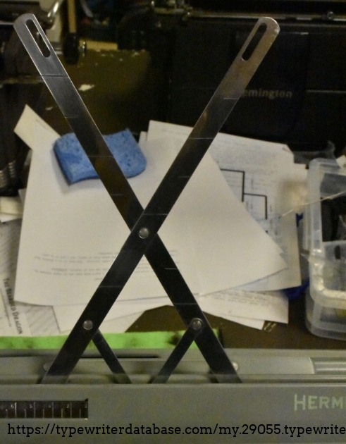 Rather ridiculous paper holder.  The lines indicate when the paper is going to run out, much like the Olympia paper holder/ruler.
