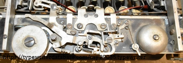 The mechanism is exposed, and looks to be the same as the 1920 model, but different from my 1915 model.