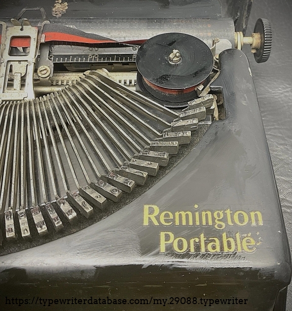 Right of top, with view of Remington Portable name decal.